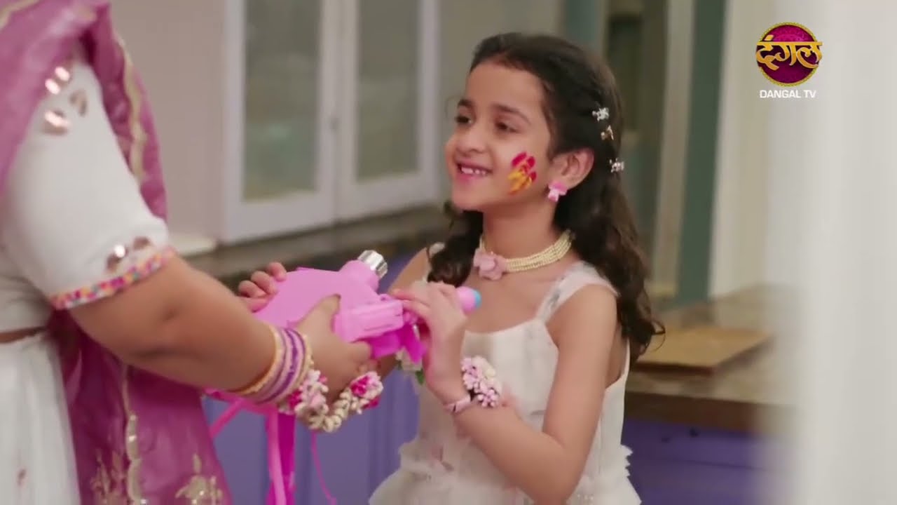 Pratham applies color to Radhya on Holi