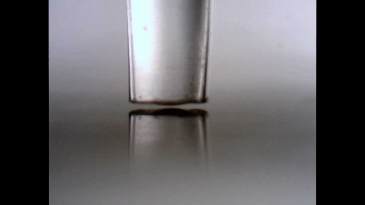 Contact printing of a nanoliter droplet