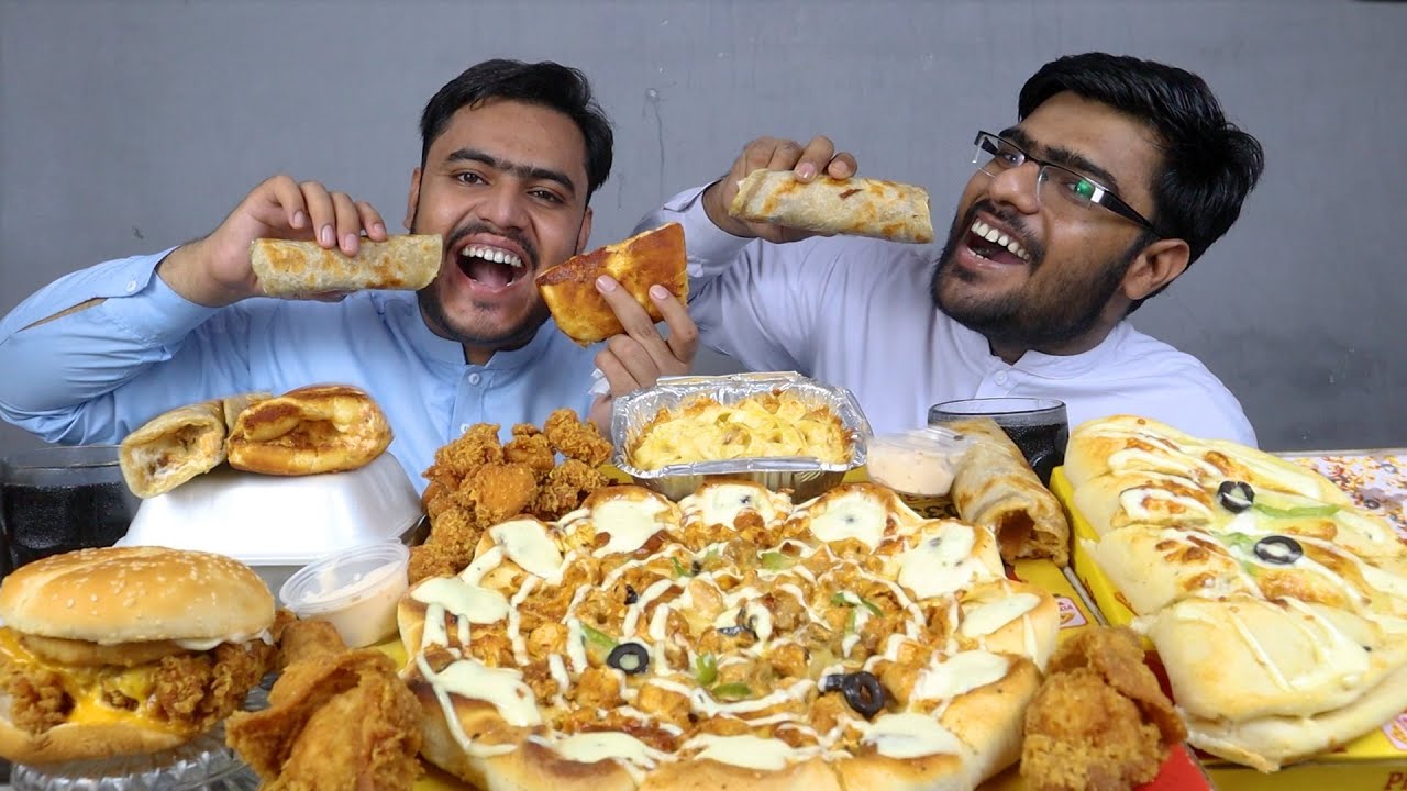 Eating Crown Crust Pizza With Tower Burger And Drumstick