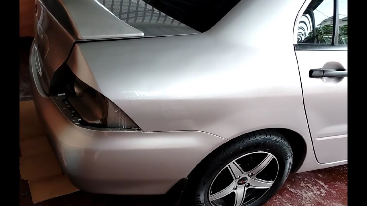 Como bajar la defensa (Bumper) trasera y reparar los brackets de plastico. Mitsubishi Lancer 02-06.