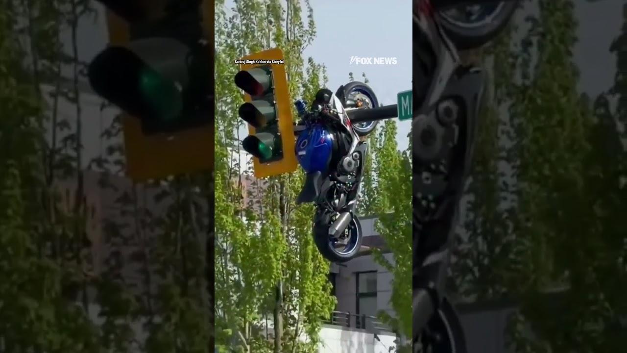 Motorcycle seen HANGING from traffic light after violent crash #shorts #us #news #viral