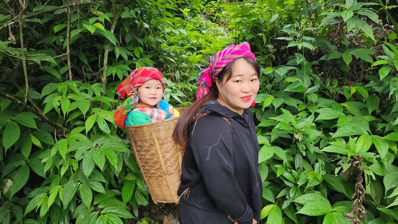 Single mom and daughter complete bamboo fence