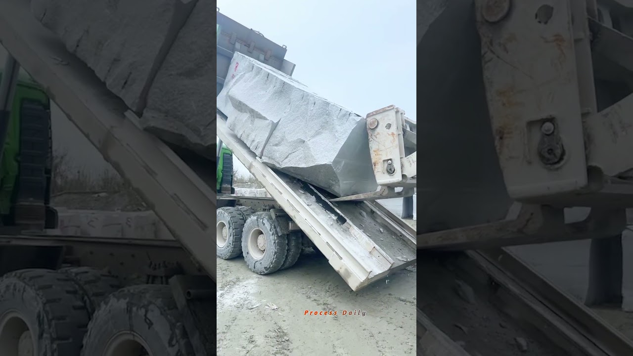 Precision Loading of Massive Granite Blocks onto Industrial Transport Trucks
