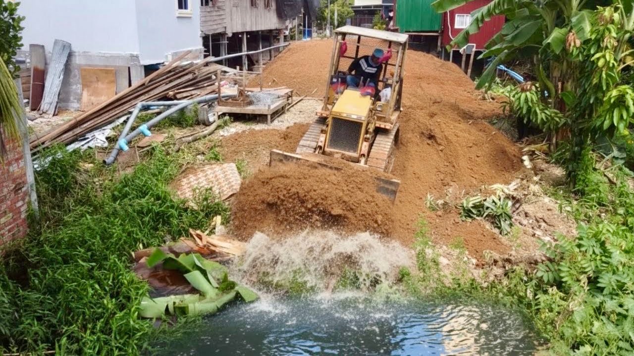 Start Opening New Project!!Bulldozer MITSUBISHI BD2A pushing Soil into Pond water& 5Ton Trucks.