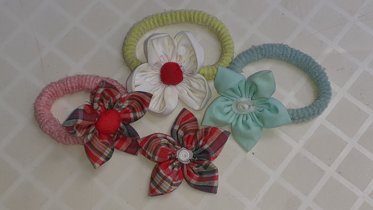 XUXA PARA CABELO DE FLOR DE TECIDO FEITO DE FUXICO