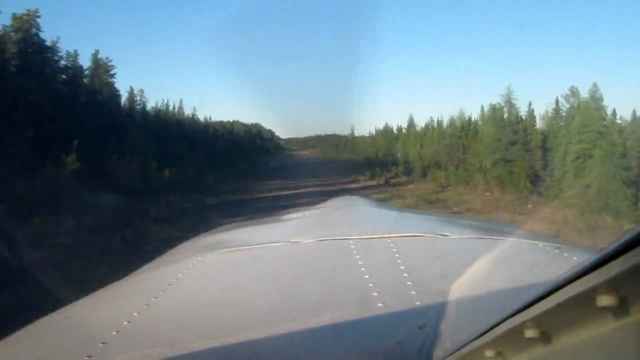 Cherokee Six 300 landing/takeoff from small gravel runway
