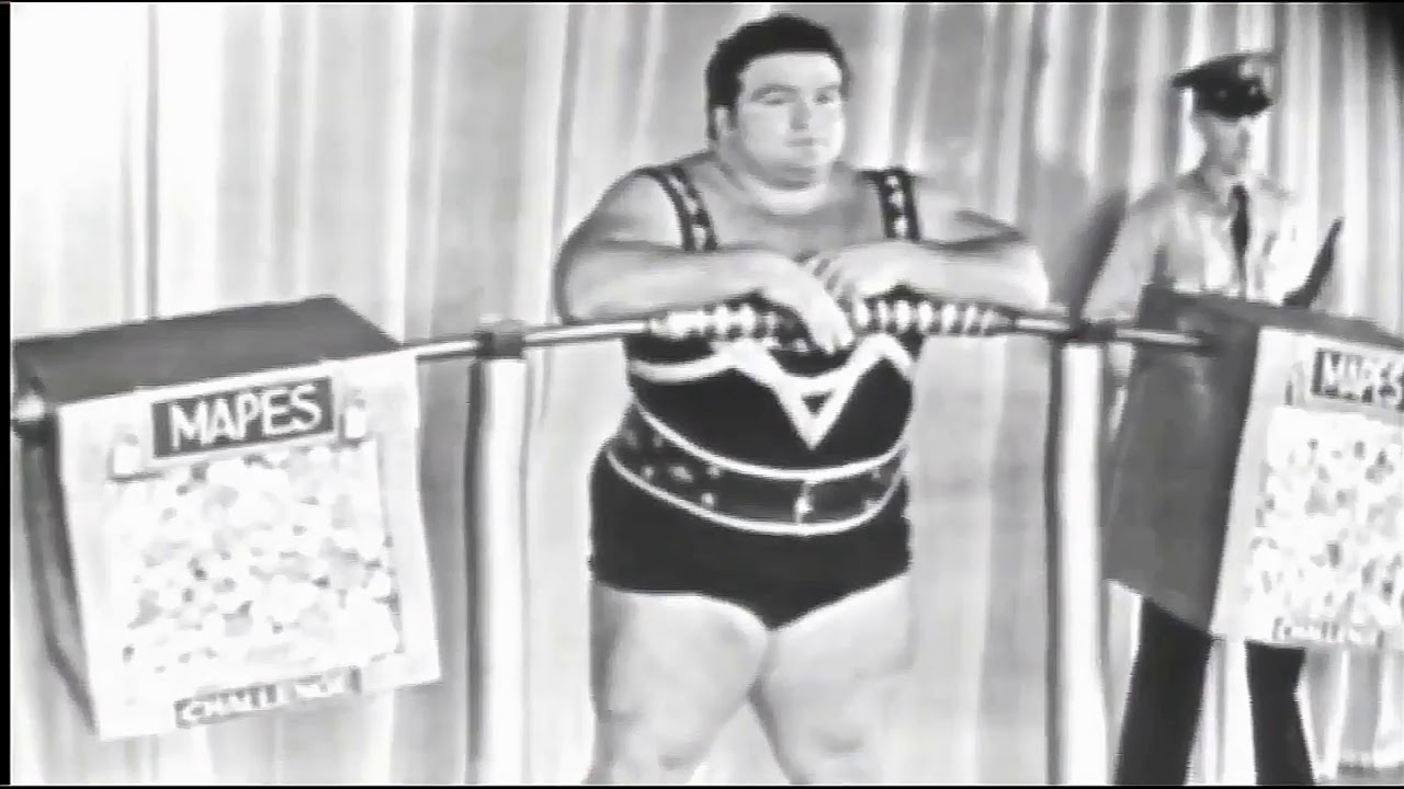 ПОЛ АНДЕРСОН ПРИСЕДАЕТ С СЕЙФОВОЙ ШТАНГОЙ В 500 КГ! PAUL ANDERSON.15 K SILVER DOLLARS SQUAT - 500 KG