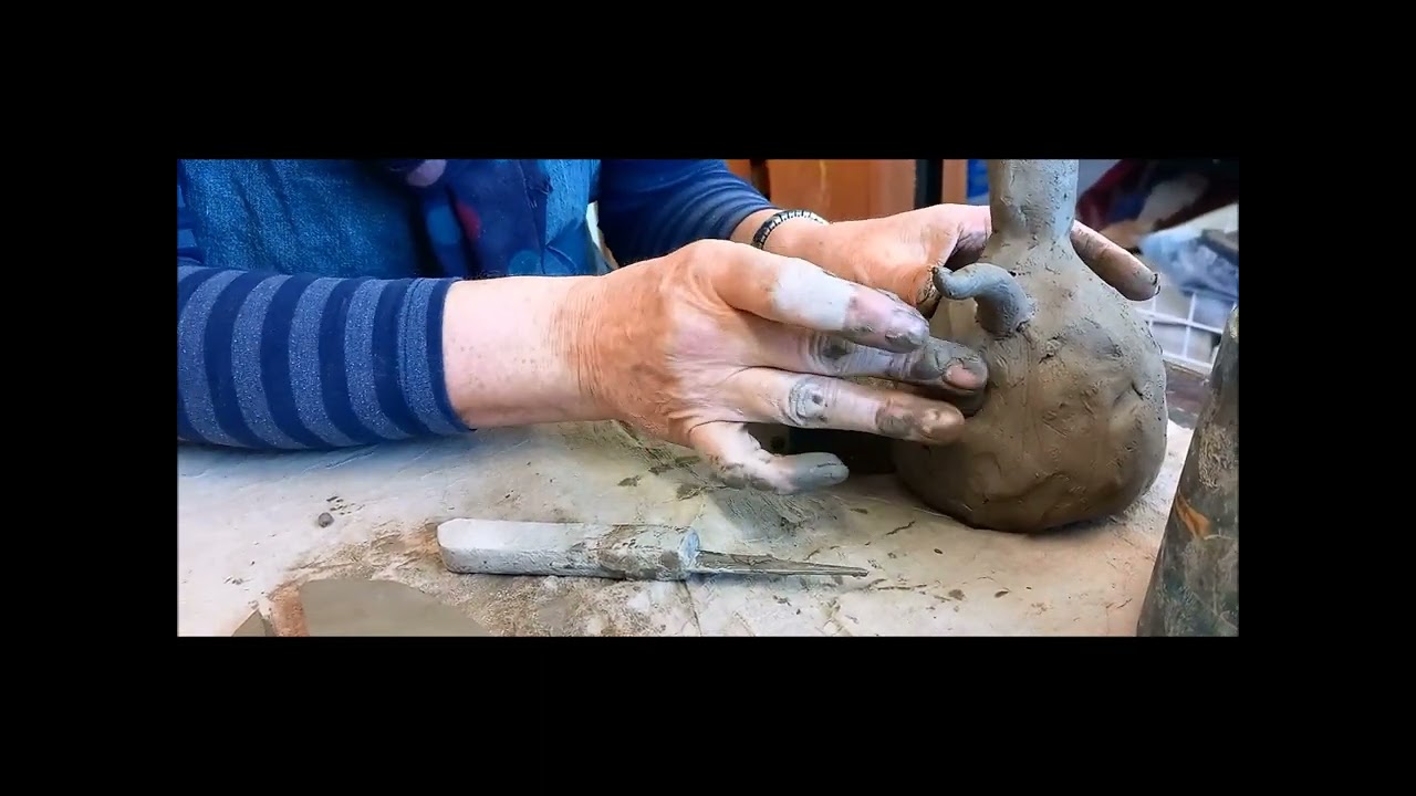 Adding clay decoration