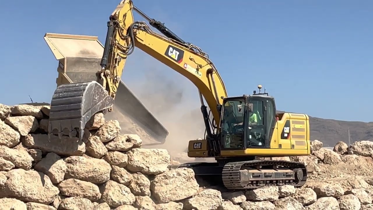 CAT 320 | Stone Wall Construction – CAT 773D Dumping