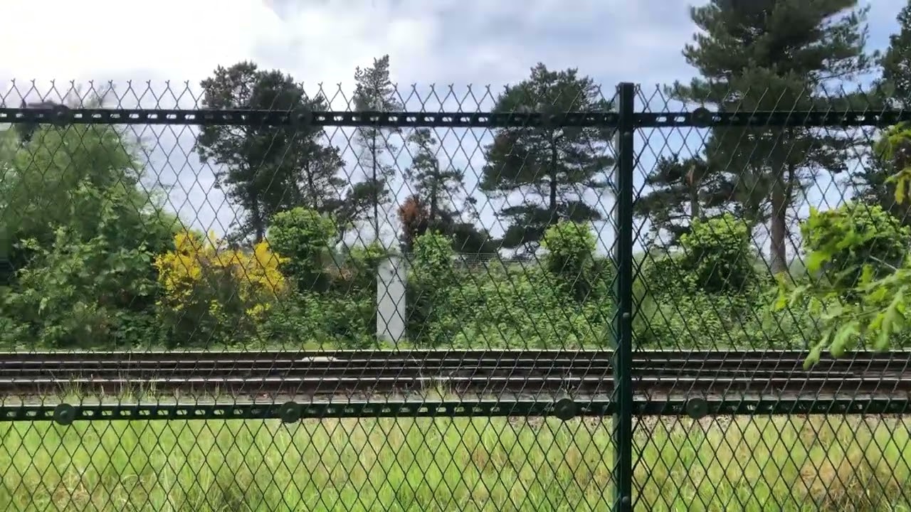 Merseyrail train approaching Freshfield service to hunts cross