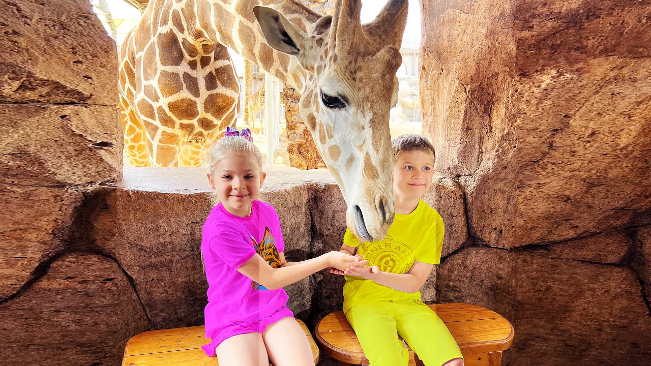 Diana and Roma feed the animals at the Emirates Park Zoo