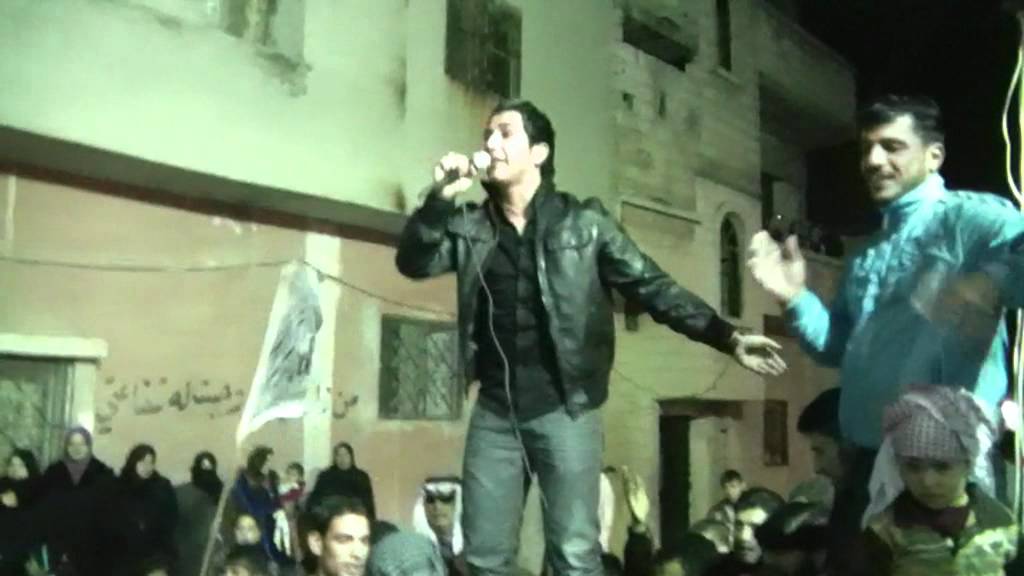 من إرشيف الشهيد طارق الاسود يقود مظاهرة في باباعمرو ج1