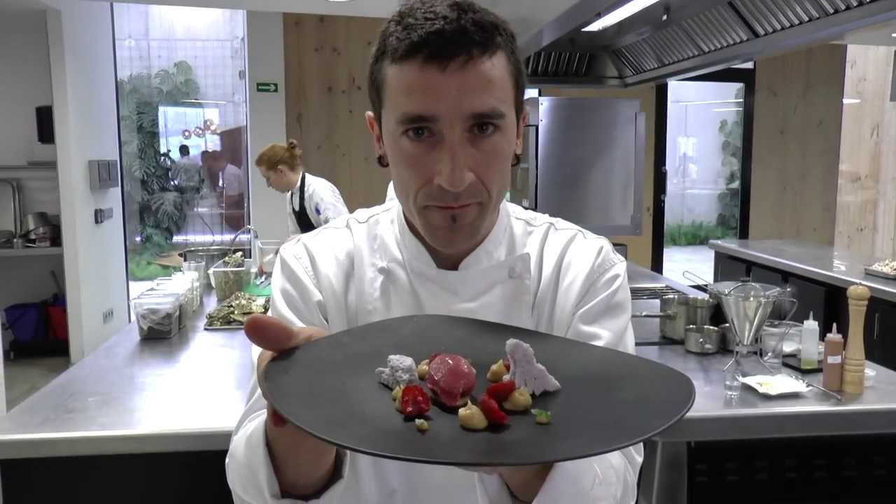 Eneko Atxa prepares a dessert with red fruits and almonds at Azurmendi