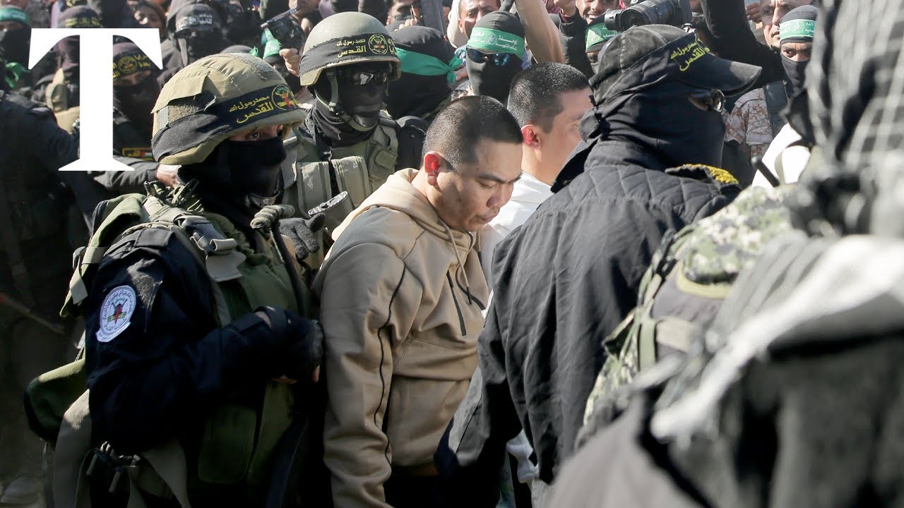 Hamas gunmen release hostages in Gaza