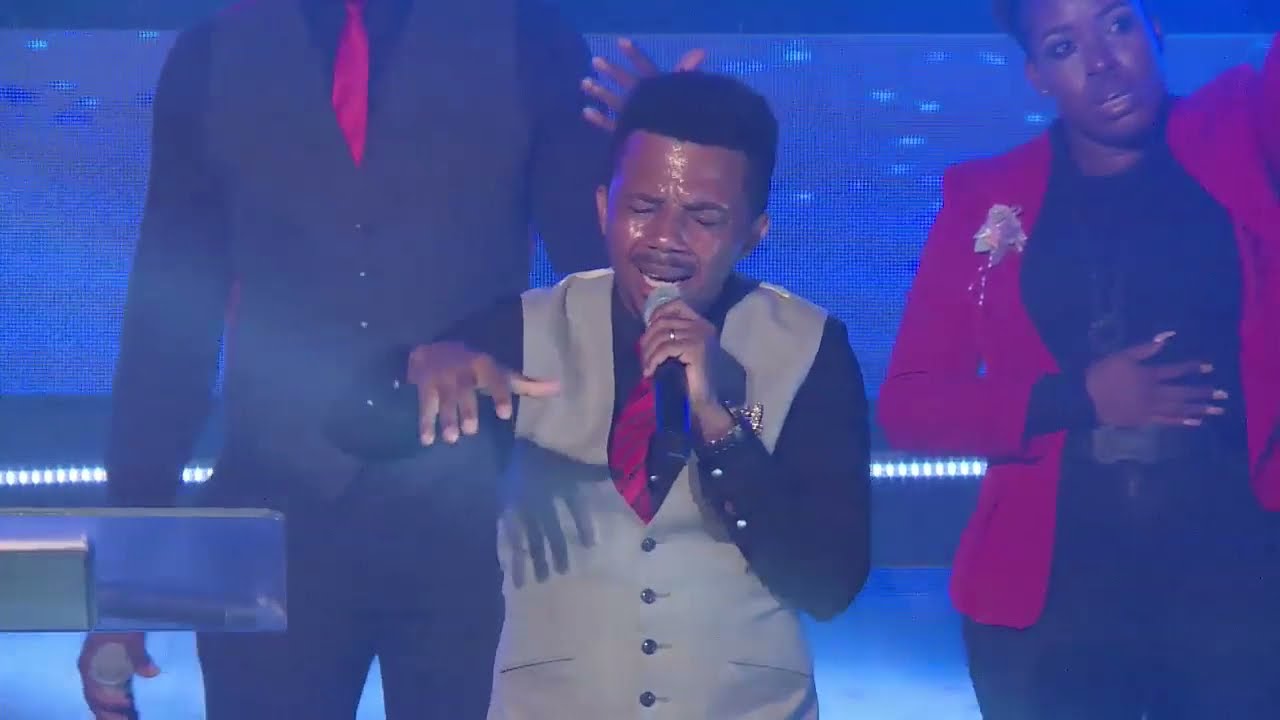 Isreal Makuo and Sarah worshipping with Exalted Tribe