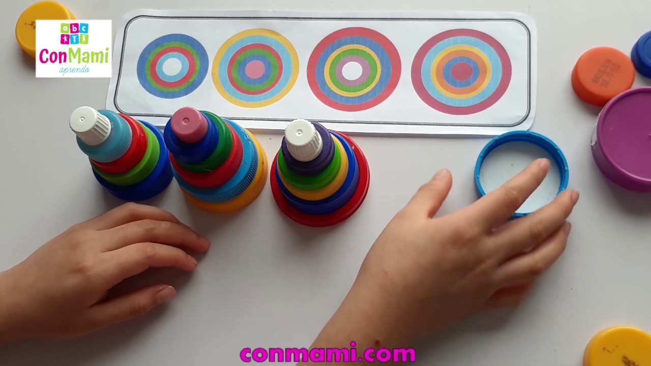 JUEGO CON TAPAS DE PLÁSTICO PARA DESARROLLAR DIVERSAS CAPACIDADES Y DESTREZAS EN LOS NIÑOS.