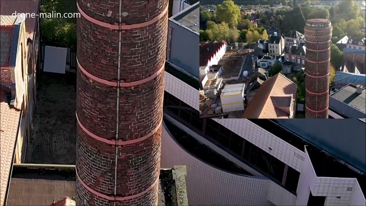 Cheminée d'usine en briques filmée par un drone