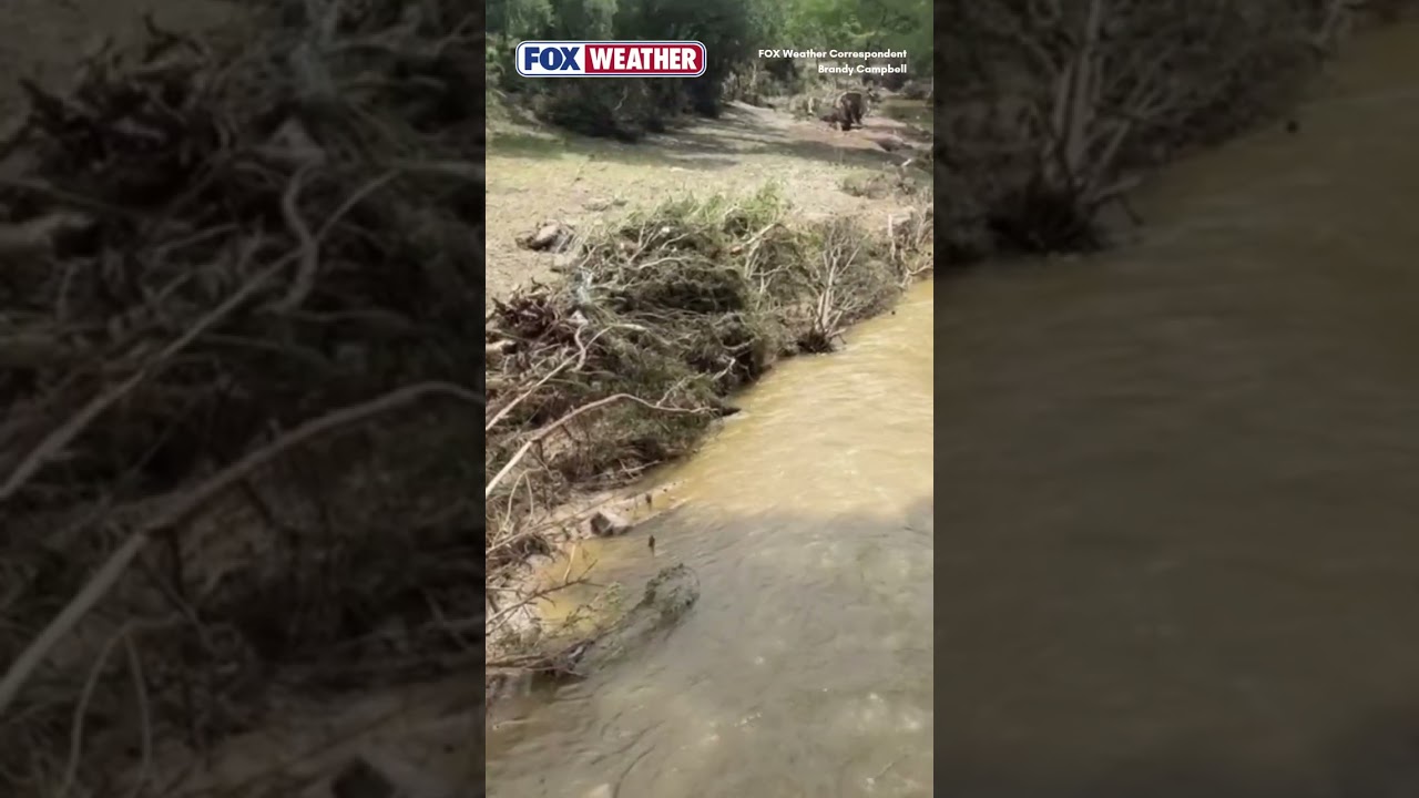 Debris Covers Town Creek In Kerrville, Texas Following Destructive Flash Flooding