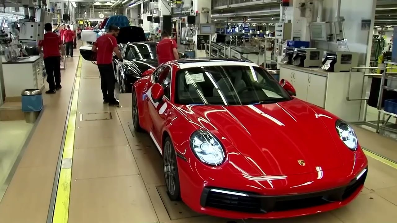 Porsche warns restructuring, trade tensions to hit year ahead | REUTERS
