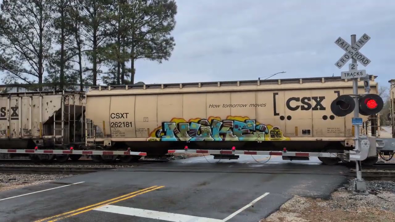 CSX 737 and CSX 426 lead a south bound grain train across Whitfield Street in Fayetteville 2/15/2026