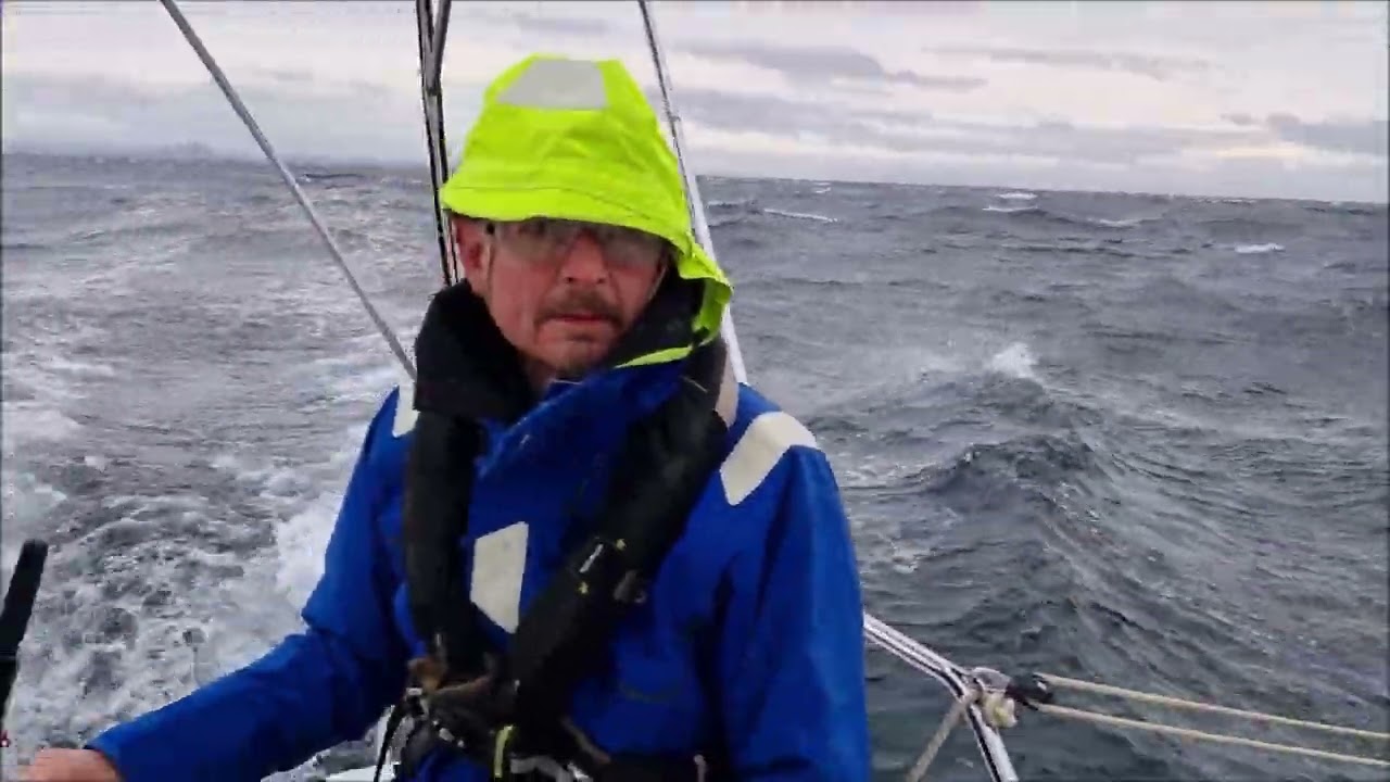 F31 trimaran sailing in breeze passing Isle of May, Firth of Forth
