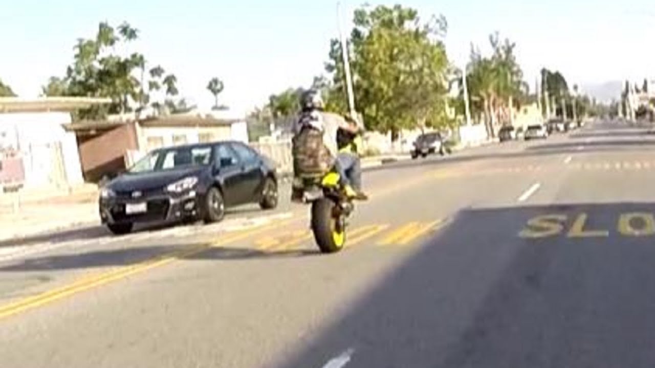 IS THAT A KID ON YOUR MOTORCYCLE ?