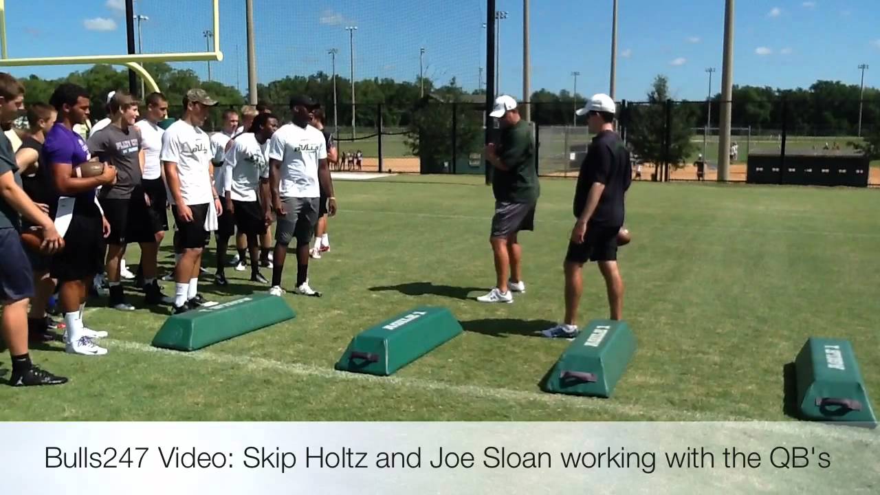 Skip Holtz and Joe Sloan work with QB's at camp