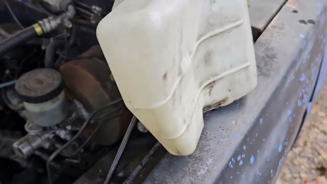 86 nissan d21. wiper fluid pump/reservoir mod install.