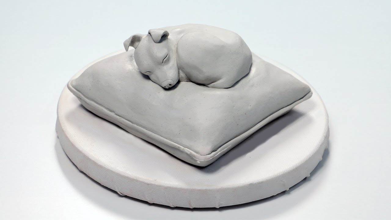 Create a dog sculpture with air drying clay