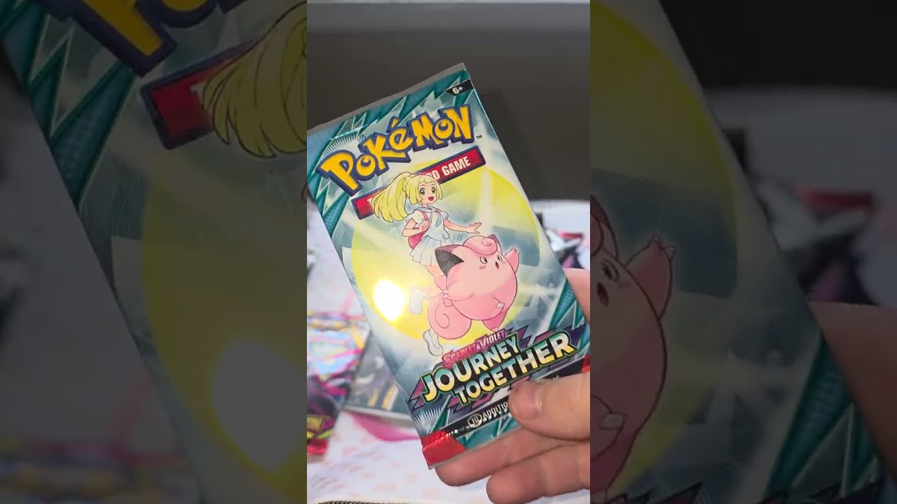 Opening a Charizard Y EX tin.