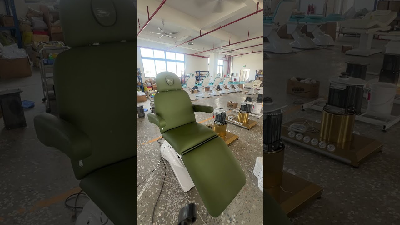 Green electric massage bed with removable armrests and a plastic base