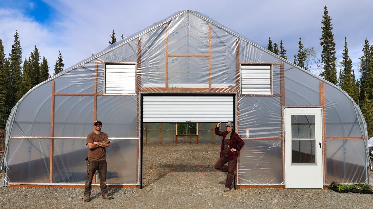 Completing Our Alaska Sized Greenhouse – Plastic Cover, Installing Doors & Roll-up Sides