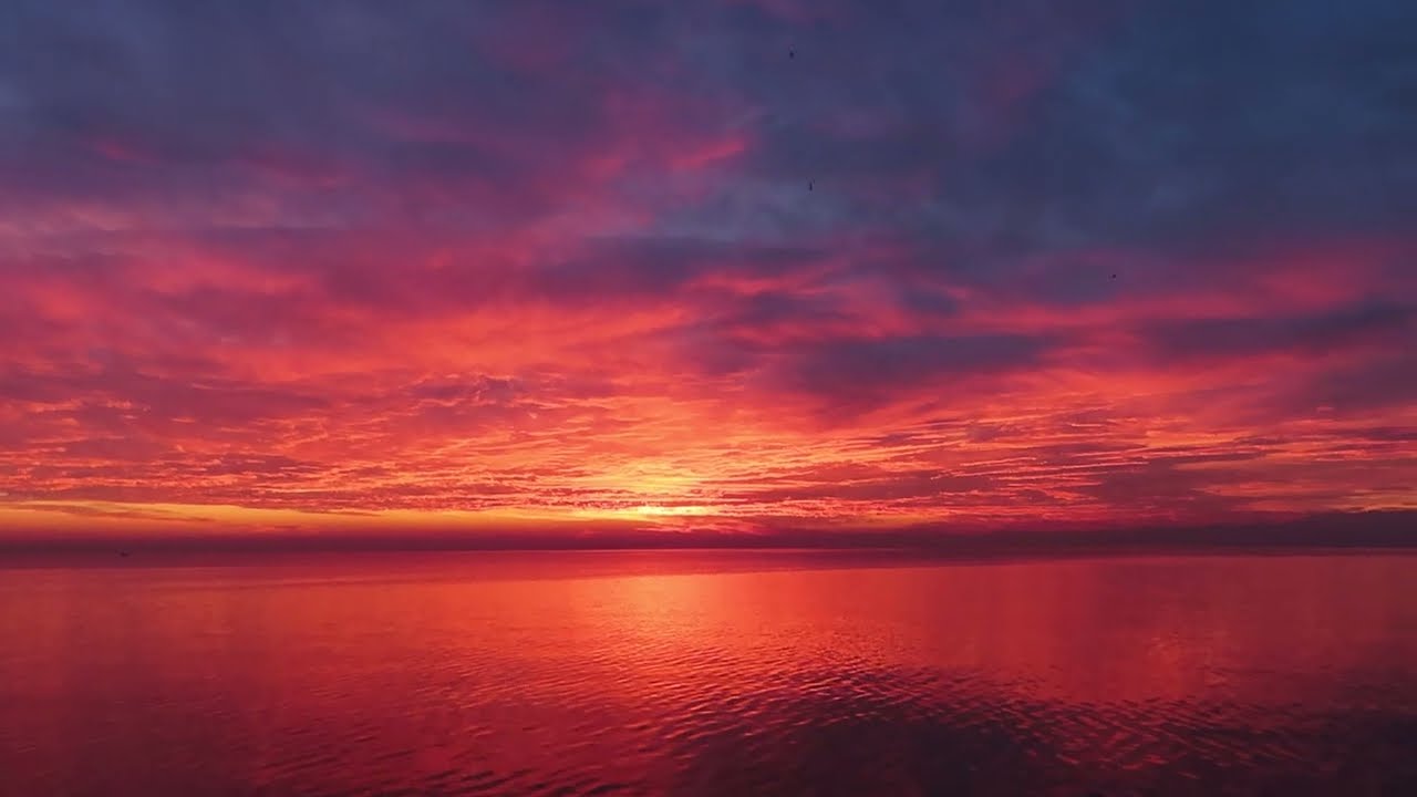 Spectacular fiery sunset on the lake - Bardolino, Lake Garda, Italy