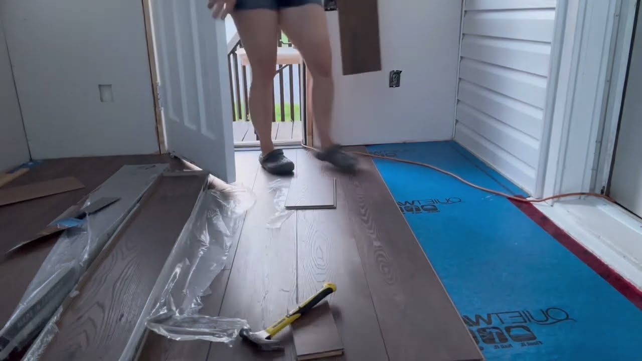 Installing beautiful laminate flooring in my porch.