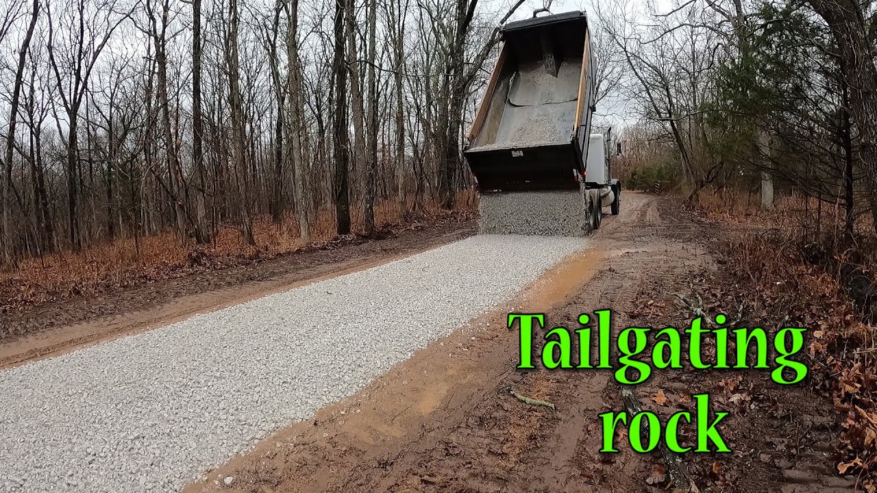 Spreading Rock On An Old Driveway