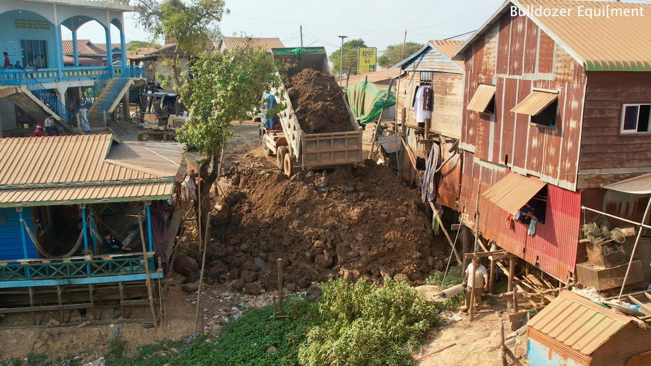 Video of filling the land with 6x19 mater land next to the Road By The river Bulldozer Pushing Soil