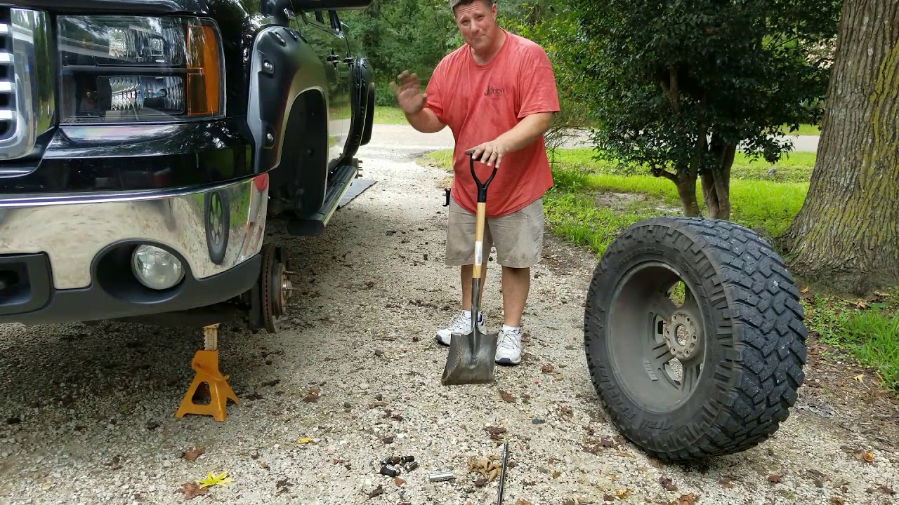 How to change a large 4x4 tire with a shovel