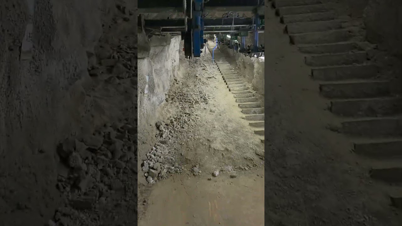 eal Footage from a Mining Shaft: People Lifting and Descending Conveyor System