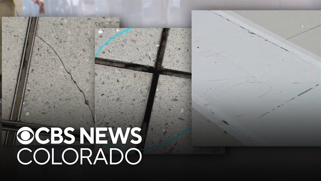 Hundreds of tiles in Denver International Airport's new Great Hall are cracked and missing grout