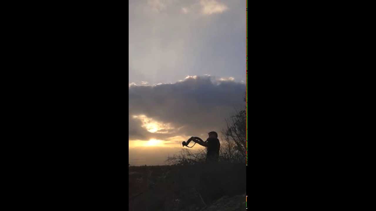Baruch Hashem Adonai. Shofar with sun and clouds