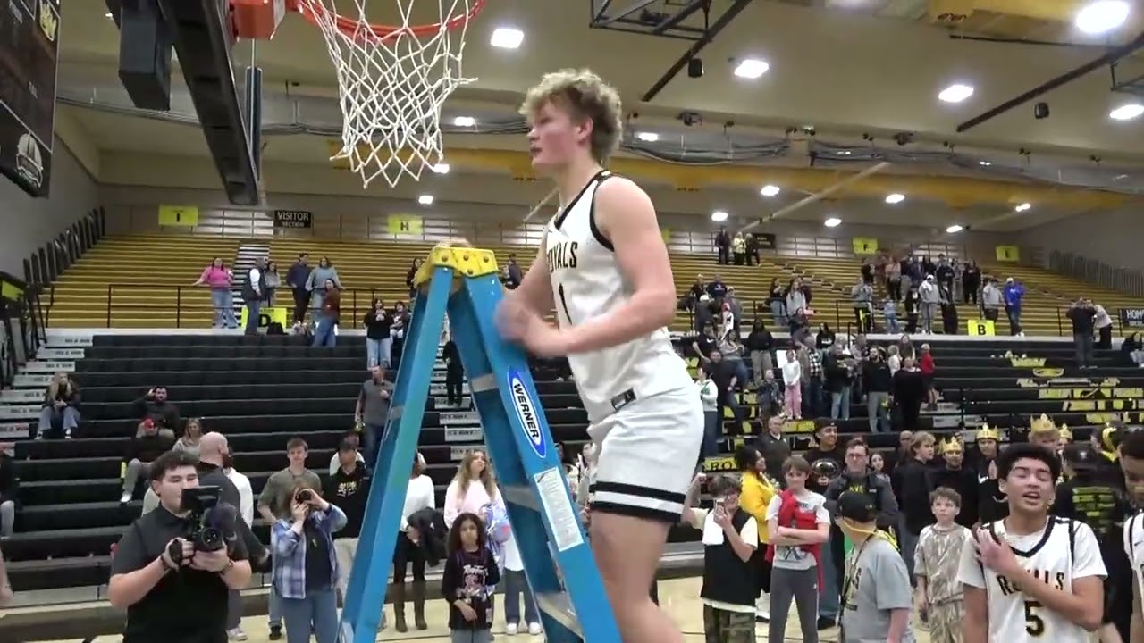 Roy High School Basketball Region 5 Champs Celebration  Varsity cutting down the net