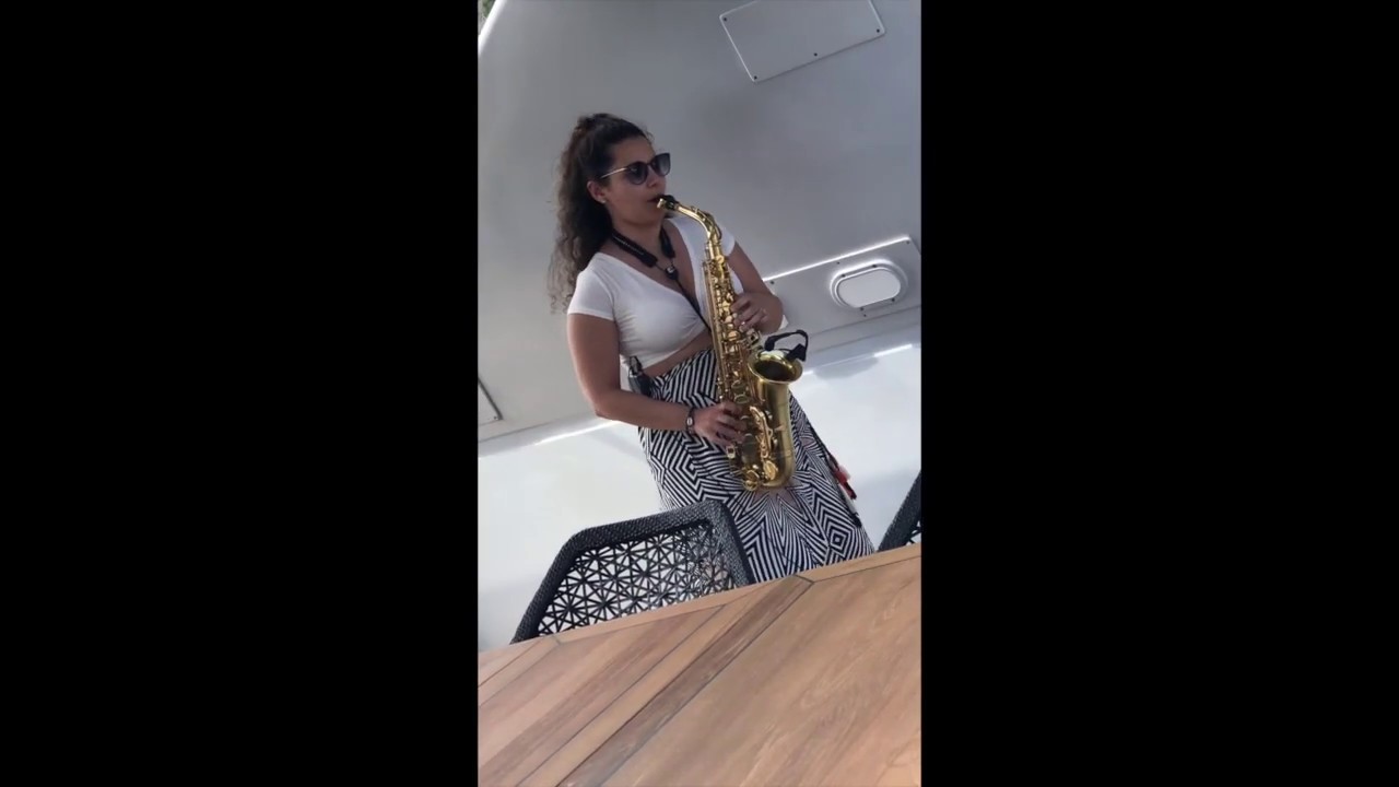 Female saxophone player yacht privet event