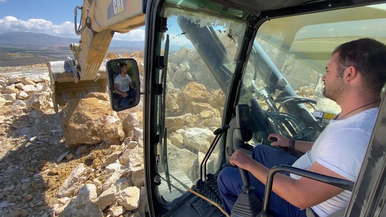 Cat 390D Excavator Loading Blasted Rocks On Cat 775E Dumper & Trucks - Pyramis Ate