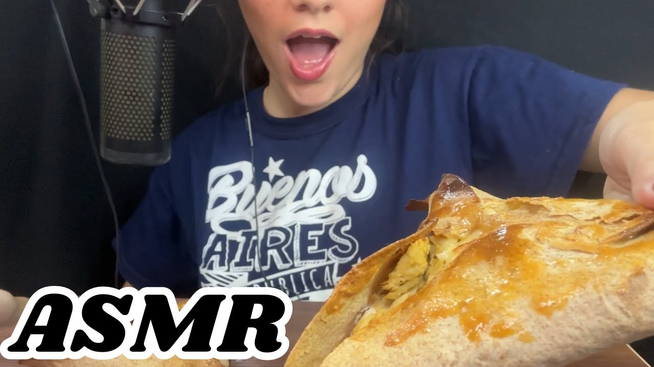 Eating chicken esfihas