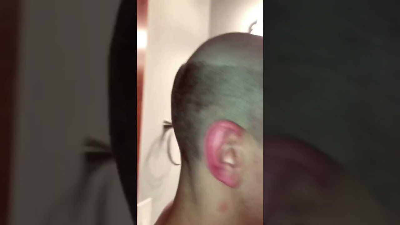 Guy gets his head shaved bald 