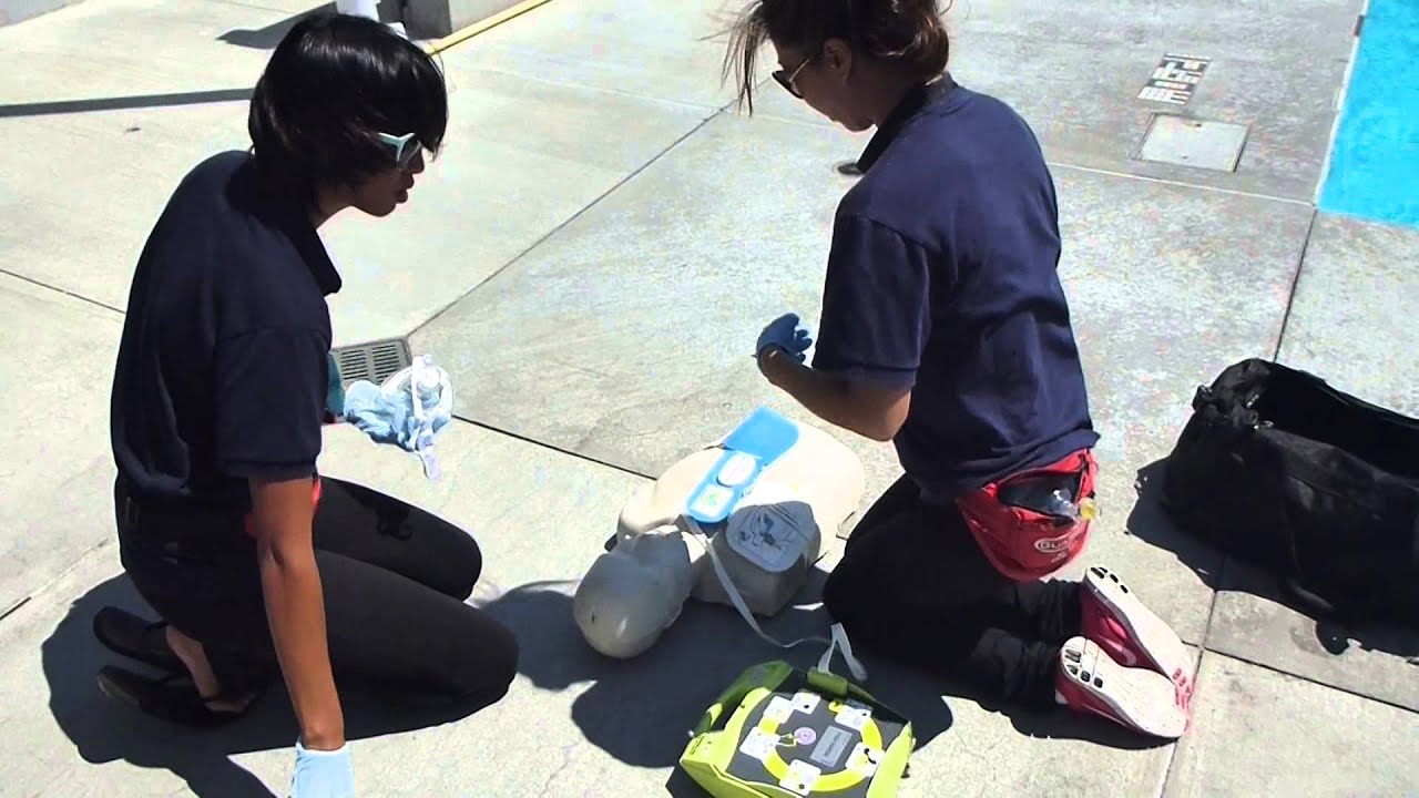 Lifeguarding Drill: 2-Rescuer CPR/AED Prog (Rescuer returns) AED first