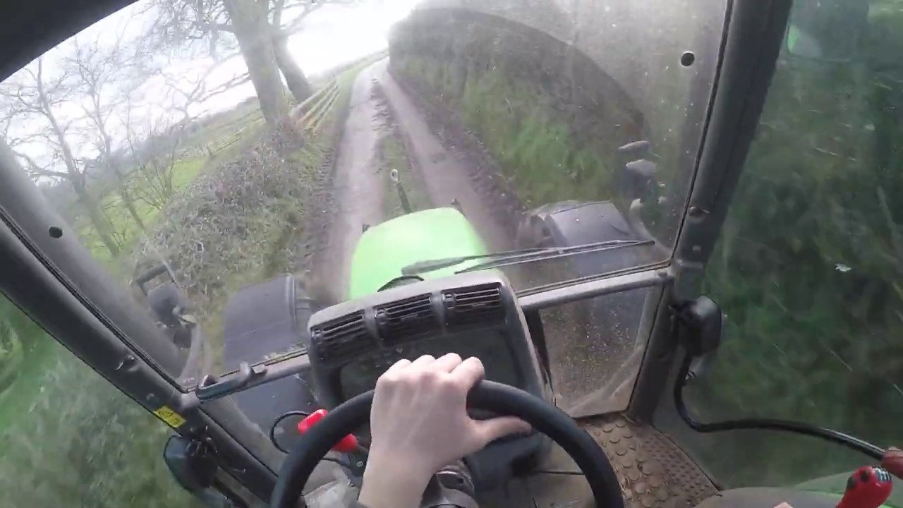Deutz Agrotron 150 heading to the farm with the livestock trailer.