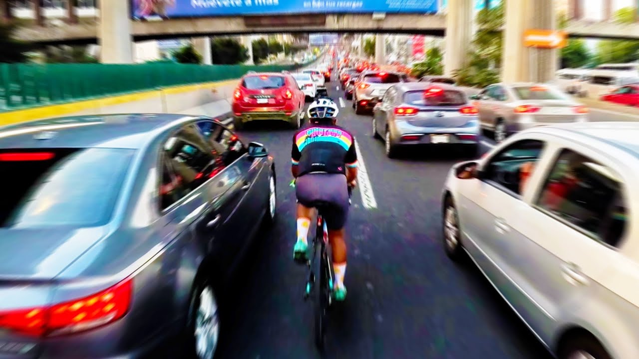 Cycling In Traffic Jam on Mexican Highway