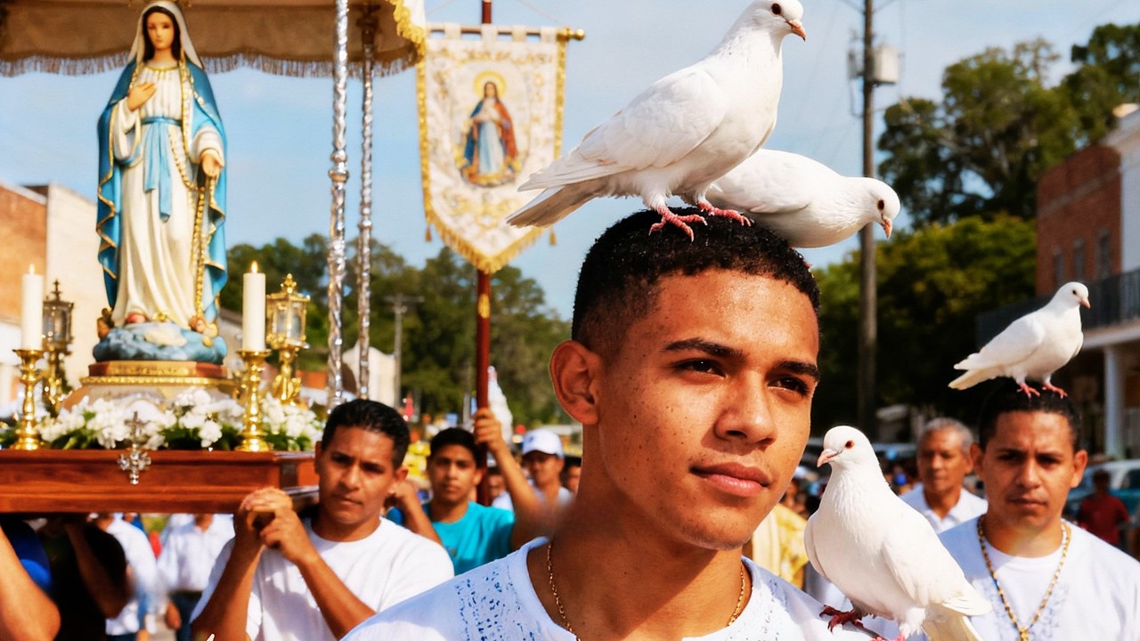 Were they angels in the form of white doves that invaded procession and landed on people's heads?