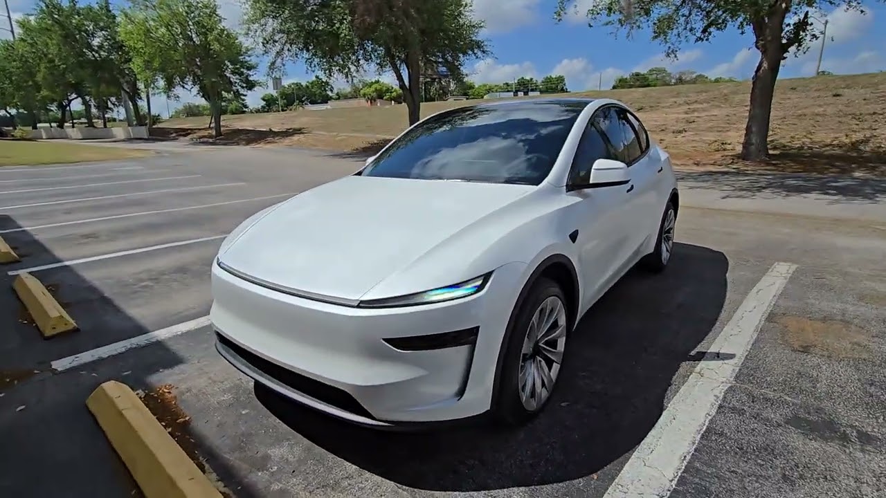 Окна Tesla Model Y 2026 года тонированы керамической пленкой Xpel в Tint Man FL Inc, Миннеола, Фл...